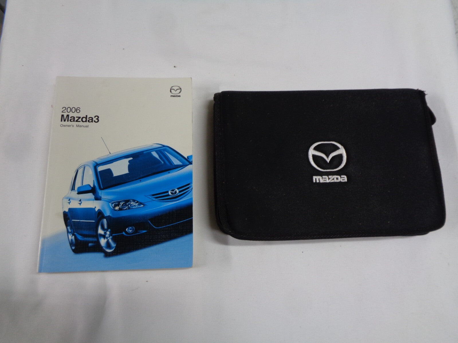 2006 MAZDA 3 OWNERS MANUAL W/ CASE OEM FREE SHIPPING! - RarePartsFinder.Com