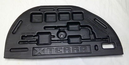 00 - 04 NISSAN XTERRA REAR FLOOR TOOL KIT P/N 84908-7Z00 GENUINE OEM (EMPTY) M2